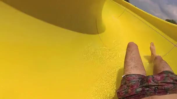 Fpv Shot Man Sliding Yellow Waterslide — Stock Video