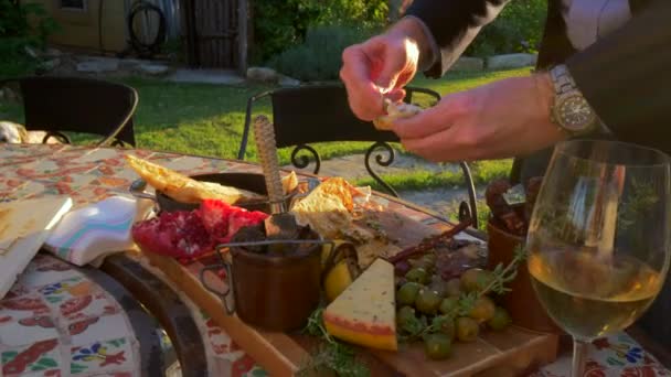 Man Spreading Cheese Slice Bread Cheese Board Array Cheeses Fruits — Stock Video