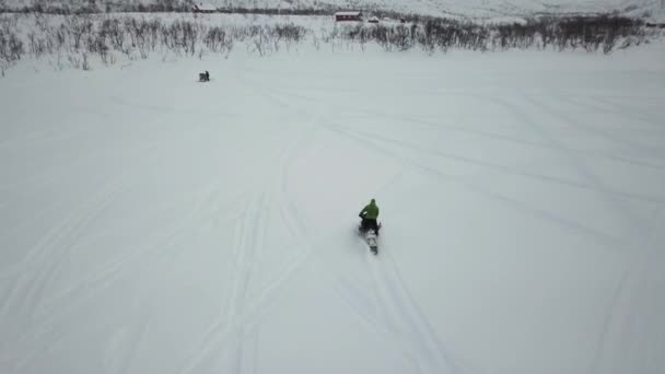 Drone Aerial Man Green Jacket Driving Snowmobile Frozen Lake — Stock Video