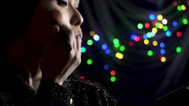 Muslim Asian Woman Applying Cosmetics Preparation Evening Colored Lights Indoors — Stock Video