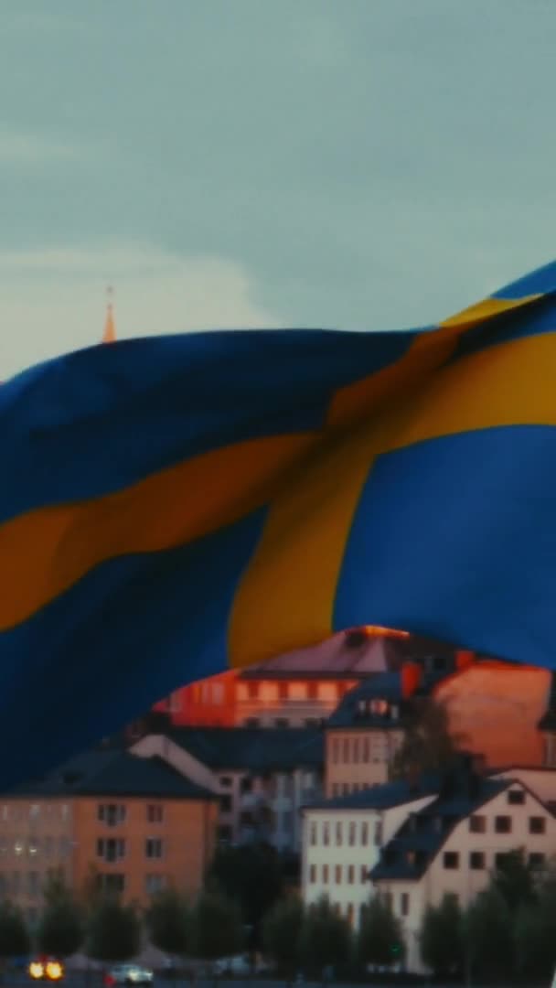 Swedish Flag Blowing Front Stockholm Sweden Sunset Slowmo Vertical — Stock Video