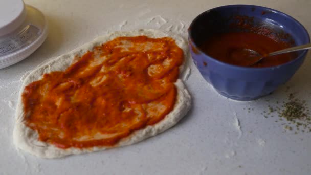 Cheese Being Put Homemade Pizza Dough Tomato Sauce — Stock Video