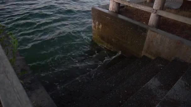 Water Lapping Set Concrete Steps Dusk — Stock Video