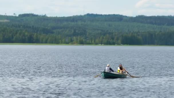 Two Unidentifiable People Rowing Rowing Boat Nordic Lake — Stock Video