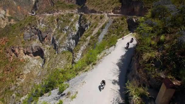 Aerial Of Motorcycle Riders Riding Motorbike On Mountain Roads