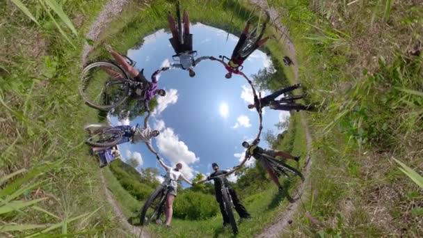 Spinning 360 Bikers Crystal Ball Tiny Planet Holding Arms Success — Stock Video