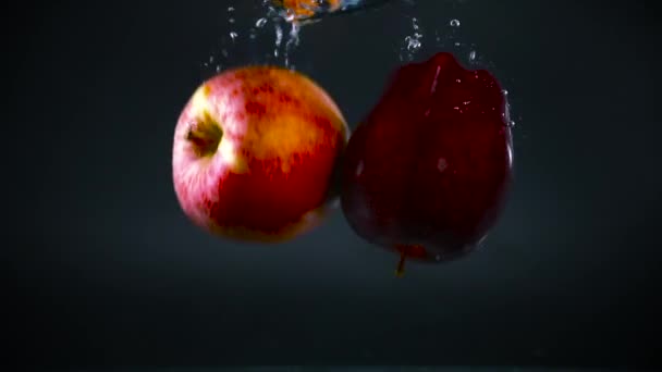 Red Fuji Apples Falling Water Slomotion — Stock Video