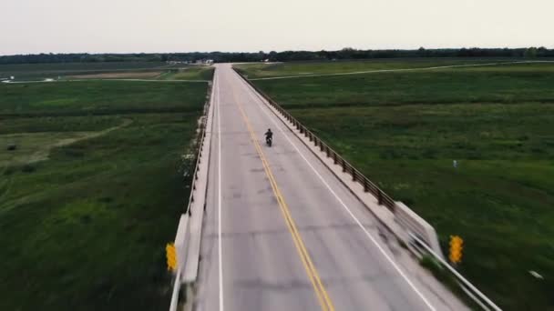 Drone Shot Single Motorcycle Riding Bridge — Stock Video