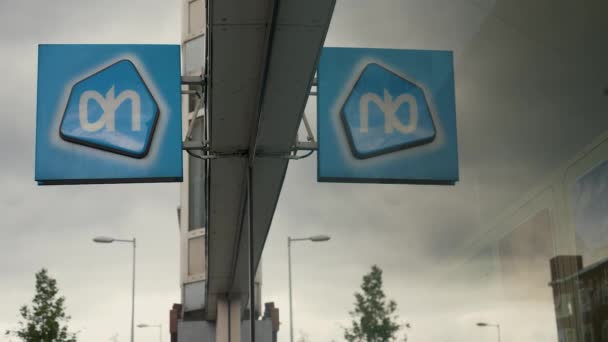 A mirrored sign of the Albert Heijn, Netherlands biggest supermarket, which is currently spreading out to Belgium and Germany, shot in Amsterdam.