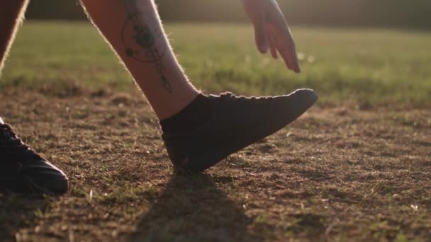 Man Stretching His Legs Run Whilst Being Silhouetted Evening Sun — Stock Video