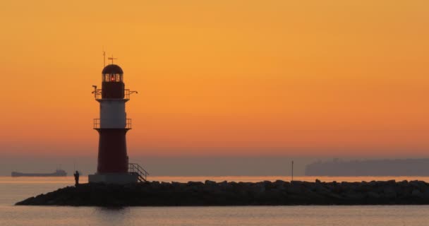 Fisherman Next Lighthouse Rostock Warnemnde Sunrise — Stock Video