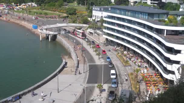 People Cars Passing Busy Seaside Town — Stock Video