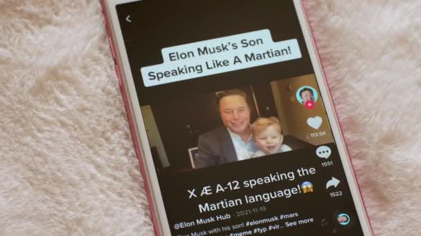 Touching Screen Smartphone Watching Elon Musk Videos Tiktok App Online — Stockvideo