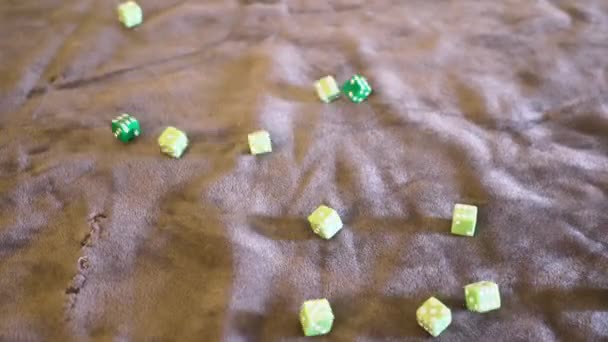 Point of view, variou dice being rolled. Lime green and green.