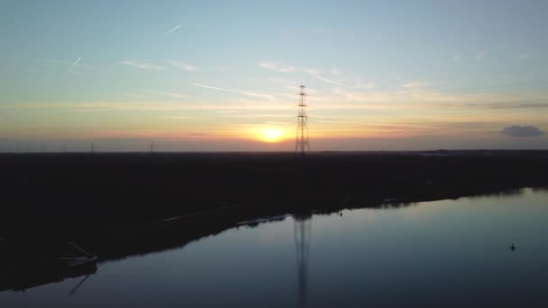 Silhouette Electricity Pole Bright Sunset Aerial Pan Right View — Wideo stockowe