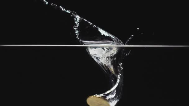 Slow Motion Single Bitcoin Dropping Water — Stock Video