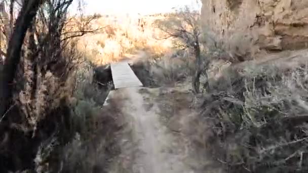 Passing Small Wooden Bridge Deep Ditch Desert Trail Pov Cyclist — Stock video