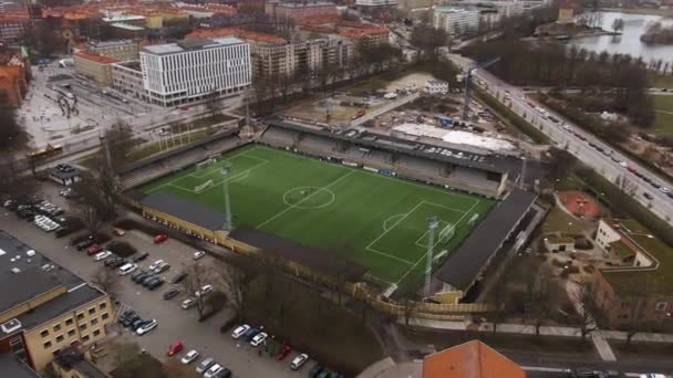 People training on soccer field at Malmo, Sweden. Aerial top-down circling
