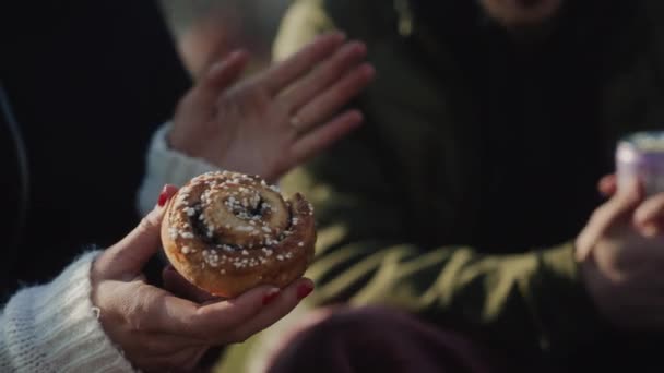 Girl Eating Delicious Cinnamon Bun While Talking Group Friends Discussing — Vídeo de Stock