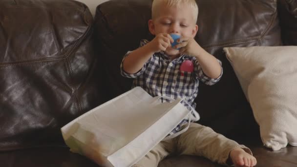 Slow Motion Shot Young Blonde Boy Playing Blue Easter Egg — Vídeo de stock