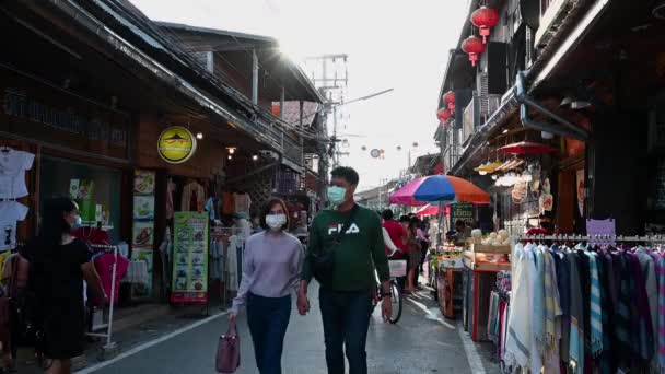 Two People Holding Hands Pass Person Bicycle While Street Busy — 비디오