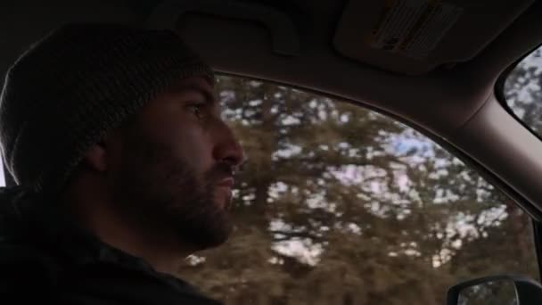 Interior Care Shot Young Millennial Male Beanie Driving Sunset Mountain — Vídeo de Stock