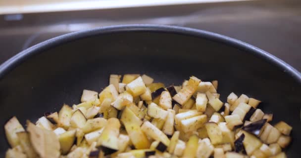 Fresh Eggplant Cut Chunks Cooking Pan Close Dolly Out — Stock video