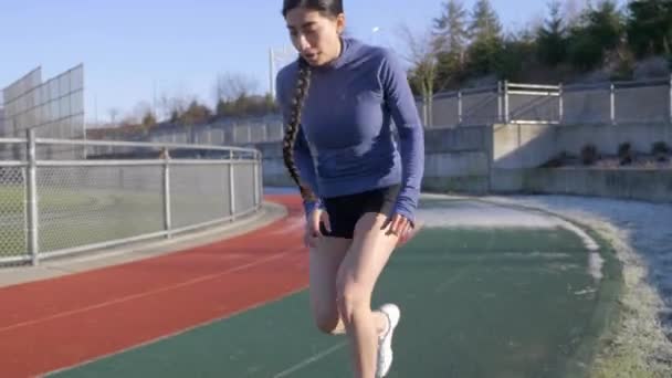 Runner Woman Stops Catch Breath Hands Knees Race Track Handheld — Stockvideo