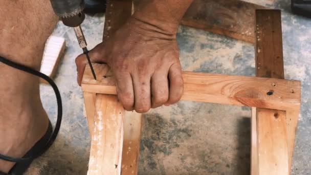 Skillfull Carpenter Employing Power Drill Attaching Screws Small Wooden Chair — Vídeo de stock