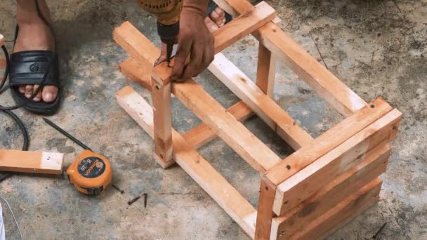 Skillfull Carpenter Employing Power Drill Attaching Screws Small Wooden Chair — Stockvideo