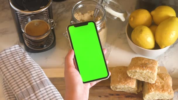 Woman Holding Green Screen Phone Kitchen — Stockvideo