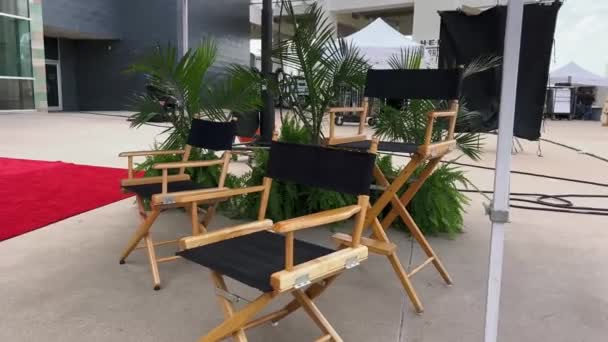 Director Seating Backstage Movie Set — Stockvideo
