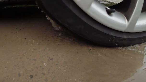 Close Car Wheel Spinning Muddy Puddle Slow Motion — Vídeo de stock