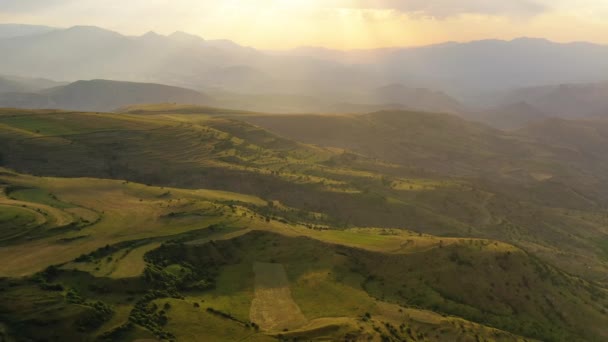 Aerial Drone View Rough Green Fields Mountainous Background Golden Hour — Video