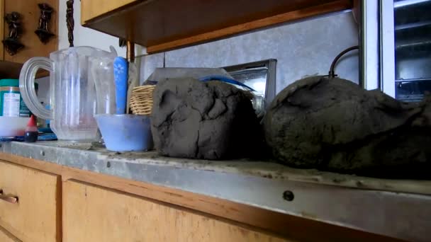 Two Piles Homemade Clay Sitting Dirt Kitchen Table — Stockvideo