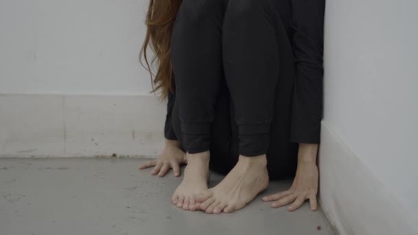 Unrecognizable Woman Sits Corner Hands Bare Feet Floor — Stock video