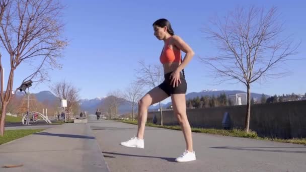 Athletic Young Woman Stretching Legs Curb — Wideo stockowe