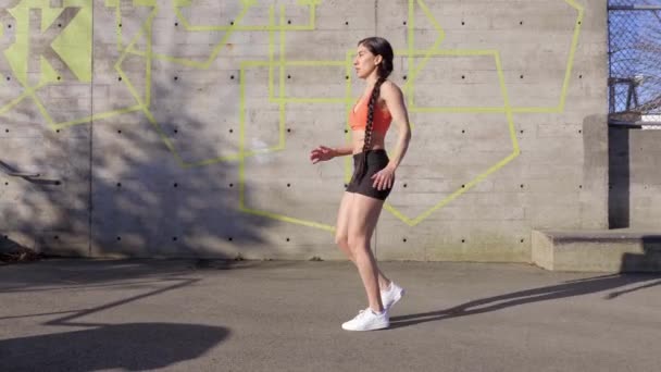 Young Woman Does High Kick Extended Arm Exercise Routine Profile — Vídeos de Stock