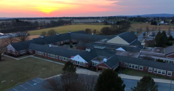 Red Brick American School Building Aerial Establishing Shot Winter Sunrise — ストック動画