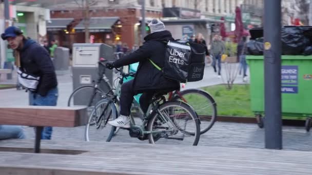 Uber Eats Delivery Rider Driving Two Deliveroo Couriers Waiting Food — Stock Video