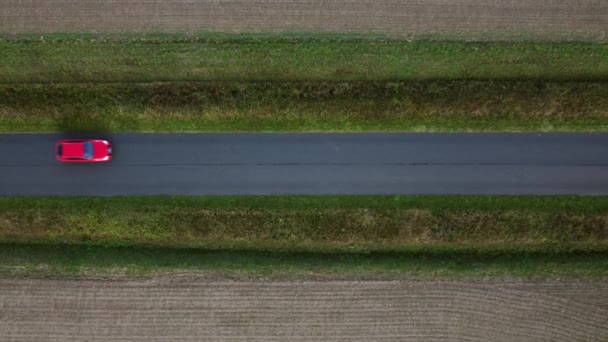 Red Car Drives Horizontally Country Road Camera — Vídeo de Stock