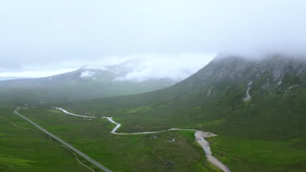 Panning Wide Drone Shot Clouds Scottish Highlands Remote Road — Stockvideo