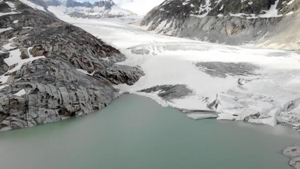 Aerial Flyover Glacial Lake Rhone Glacier Furkapass Switzerland Beginning Summer — Vídeo de Stock