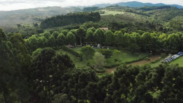 Reveal Trough Trees Shows Gorgeous Outdoor Wedding Ceremony Set Aerial — Stock video
