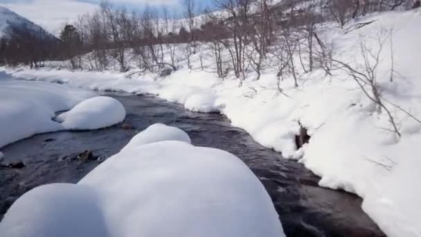 Amazing Drone Footage Flying Low Snow Capped Rocks Creek Mountainous — Stockvideo