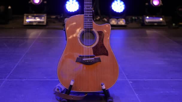 Camera Tilts Slowly Showing Taylor Acoustic Guitar Concert Stage Lights — Video