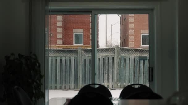 Snowing Kitchen Window Slow Motion Fence Wall Showing Background — Stockvideo