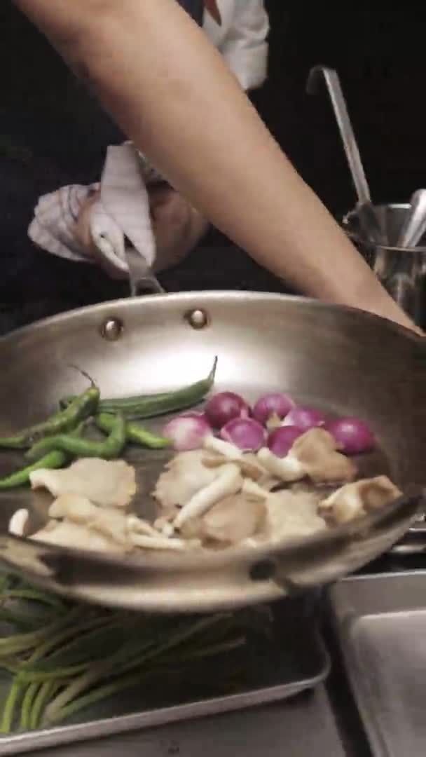 Portrait Shot Chef Adding Salt Vegetables Frying Pan Garlic Mushrooms — Vídeo de Stock