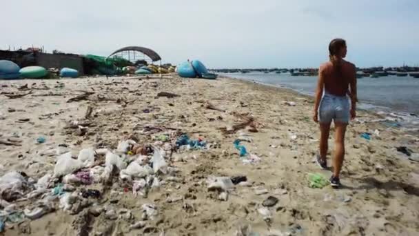 Young Woman Walking Beach Rubbish Boats Mui Harbor Aerial Rear — Stock Video