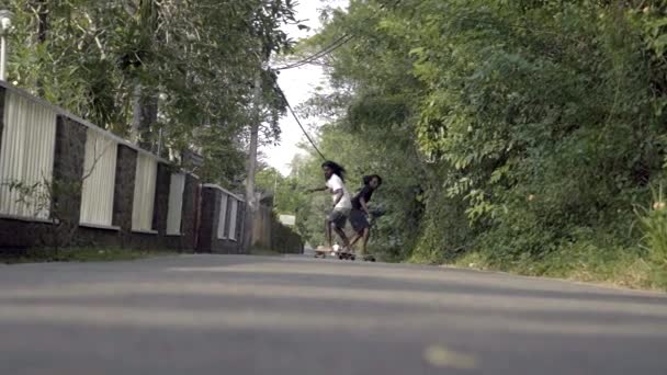 Wide Slow Motion Shot Skaters Carving Road — Video Stock